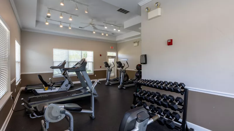 Large gym area with multiple machine options for residents.