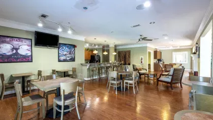 Large clubhouse with TVs and coffee bar for residents to enjoy.