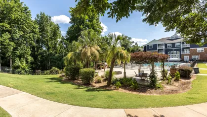 Manicured outdoor walkway located near the resort style swimming pool.