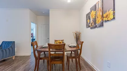Kitchen nook with large 4-seater table. 