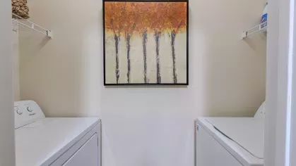 Included laundry space with washer and dryer. 