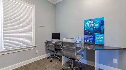 Business center with computer for residents to use.