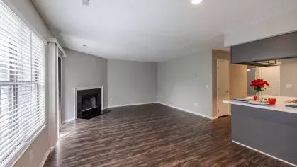 Open concept layout with welcoming fireplace.