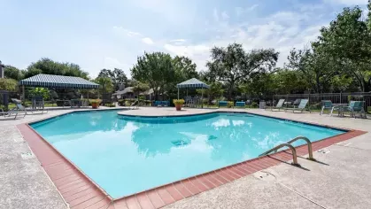 Sparkling, resort style pool with ample seating to welcome residents. 