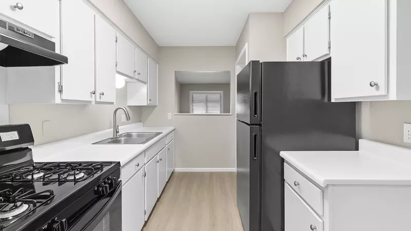Flats at Wellington open, bright kitchen with ample cabinet space.