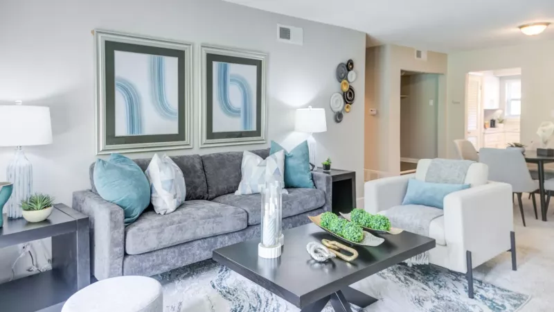 Bright, open living room with attached dining area.