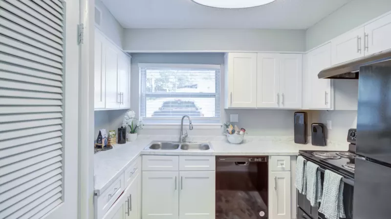 Updated kitchen with sleek appliances, and ample cabinet space.