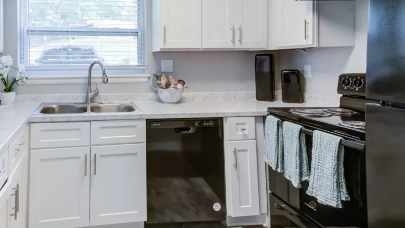 Updated kitchen with sleek appliances, and ample cabinet space.