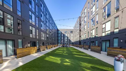 Open courtyard with twinkling lights overhead for residents. 