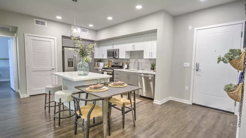 Bright, open kitchen with overhead lighting and updated appliances.