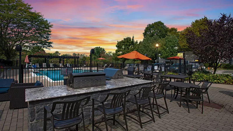Twilight show of eating area located near swimming pool