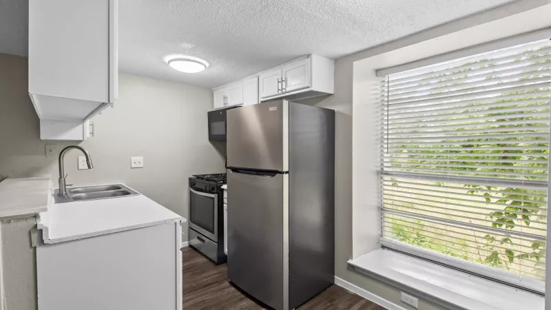 Updated kitchen with stainless steel appliances.