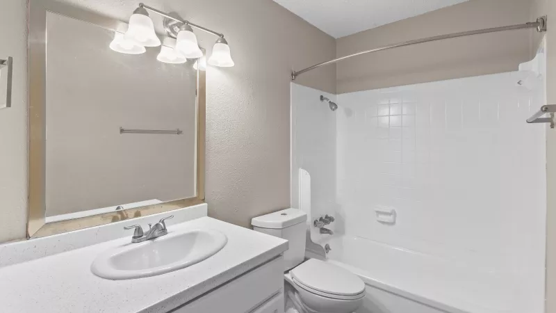 Bright, updated bathroom with shower and tub combination. 