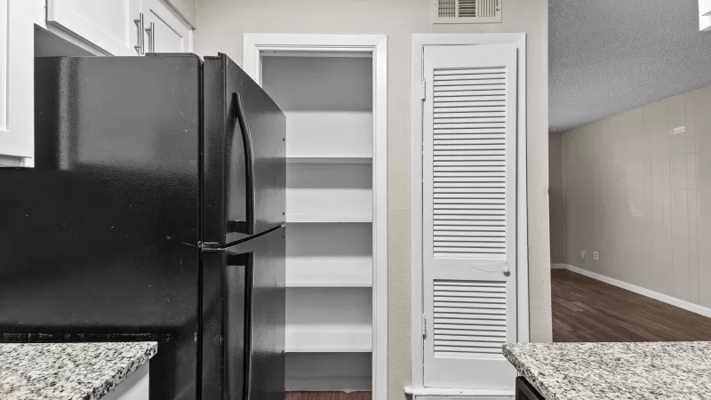 Bright, open kitchen with updated appliances and fixtures. 