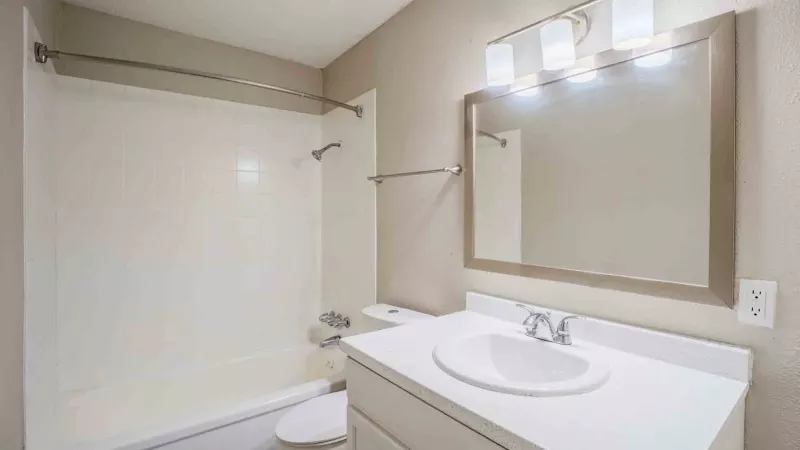 Bright bathroom with updated fixtures and shower and tub combination.