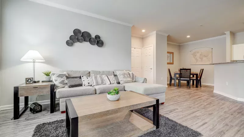 Open living and dining area with stylish decor and durable vinyl flooring at Gates at Citiplace in Baton Rouge, LA