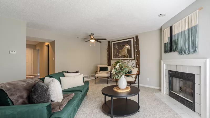 Parkhill Luxury living room with large, welcoming layout and fireplace.