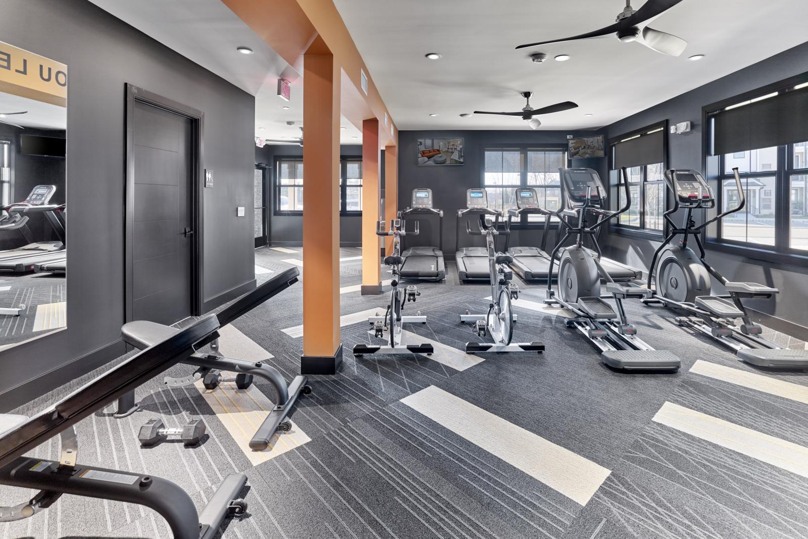 Fitness center with workout benches, and elliptical equipment 
