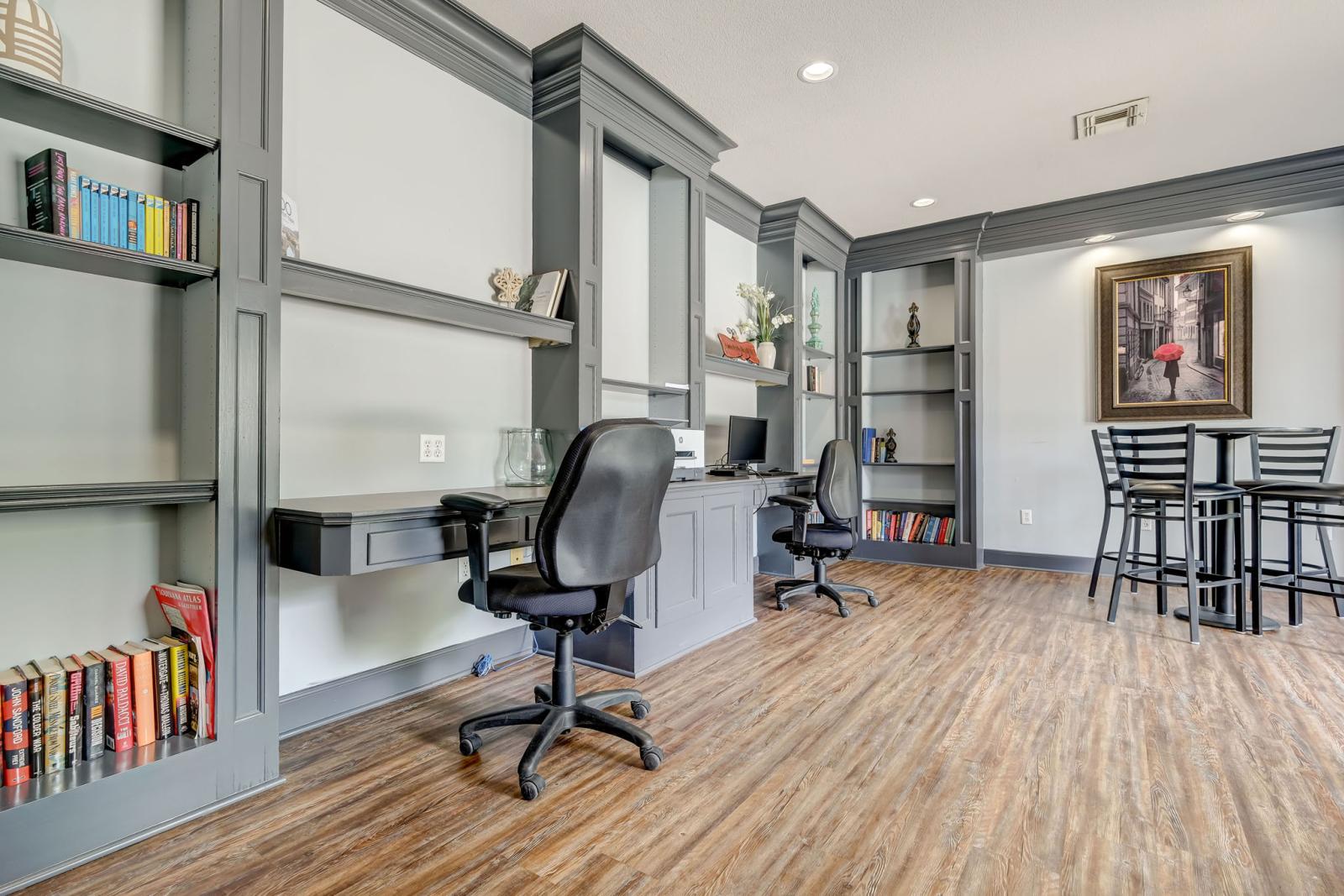 Stylish coworking space with modern desks and shelving inside Gates at Citiplace’s community business center
