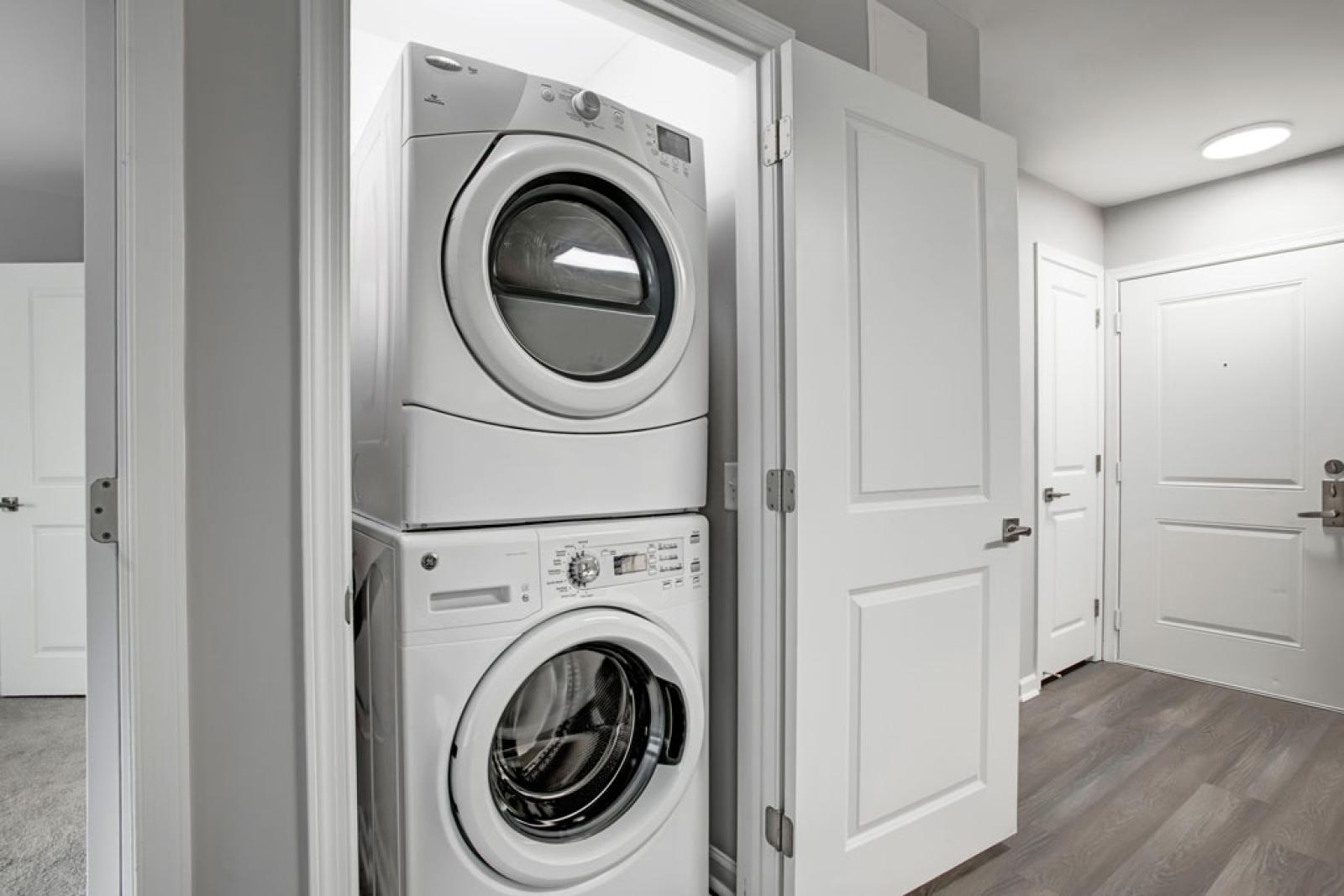 In-unit washer and dryer conveniently located at the front of the apartment near the entry way.
