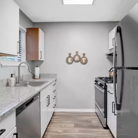 Contemporary kitchen with stainless steel appliances, granite countertops, and elegant cabinetry.