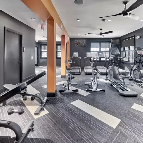 Fitness center with workout benches, and elliptical equipment 