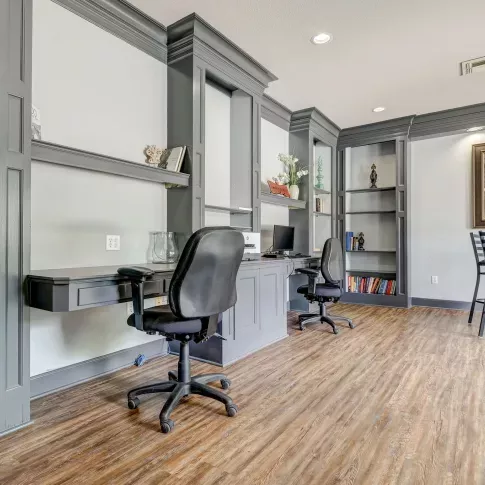 Stylish coworking space with modern desks and shelving inside Gates at Citiplace’s community business center