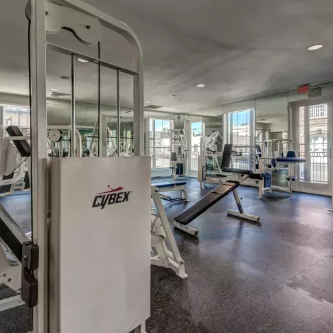 State-of-the-art Cybex strength machines in The Saulet’s luxury apartment fitness center.
