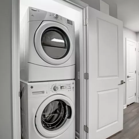 In-unit washer and dryer conveniently located at the front of the apartment near the entry way.