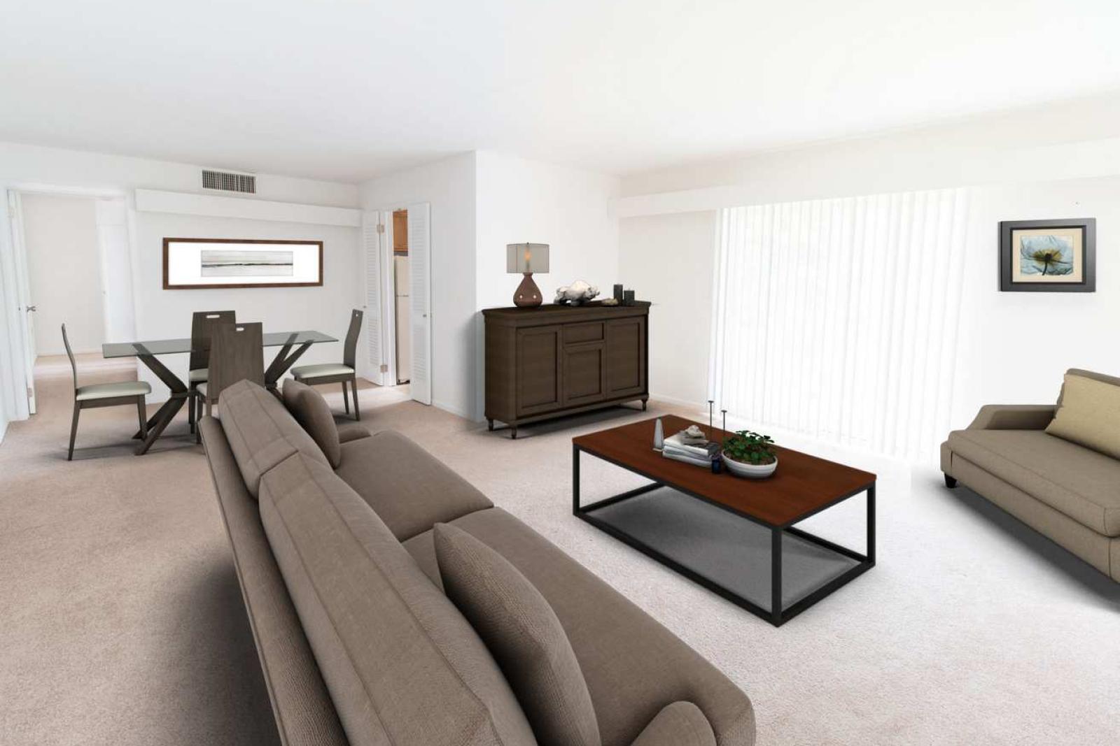 A modern living and dining room features neutral-colored furniture, a glass dining table, and large windows with vertical blinds allowing natural light.