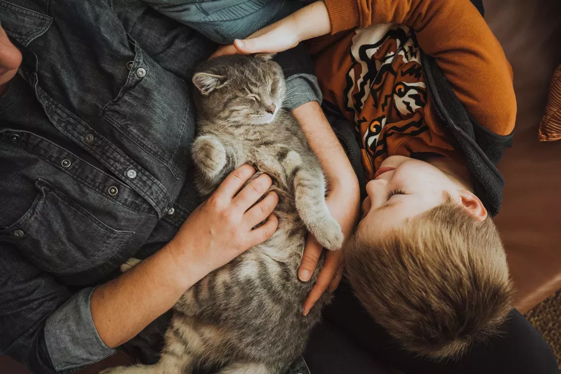 Adult and Child holding cat