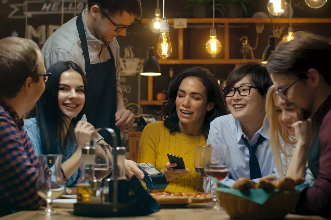 Friends eating at an upscale pizza place