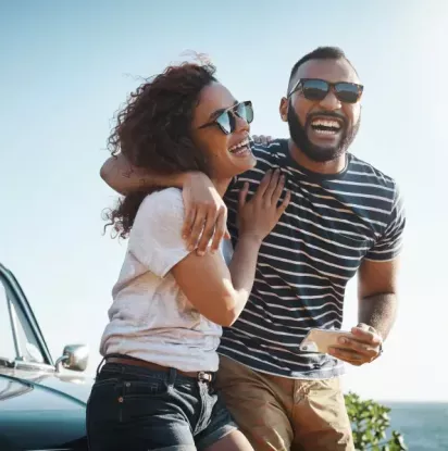 Couple laughing at the beach
