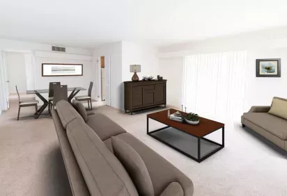 A modern living and dining room features neutral-colored furniture, a glass dining table, and large windows with vertical blinds allowing natural light.