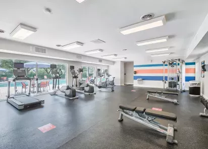 Fully equipped fitness center featuring cardio machines, free weights, and training equipment for a healthy lifestyle.