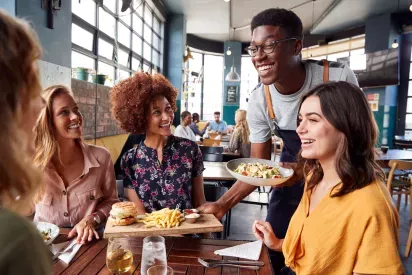 A group of people having lunch at a restaurant