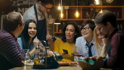 Friends eating at an upscale pizza place