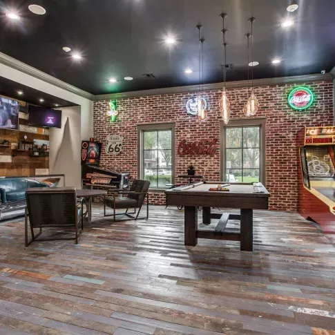 Large, expansive game room with multiple arcade and bar games in Irving, Texas.