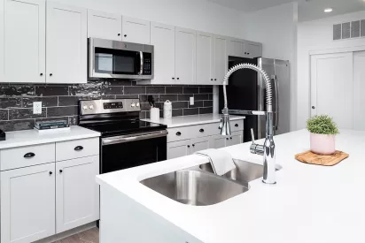 Updated kitchen with stainless steel appliances.
