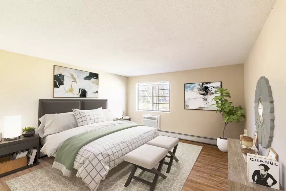 Bright, neutral-toned bedroom with a queen bed, two benches, abstract art, a nightstand, and a dresser.