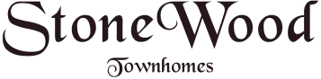 The logo for StoneWood Townhomes features elegant typography with "StoneWood" in a stylized script font and "Townhomes" displayed below in a smaller, classic font.