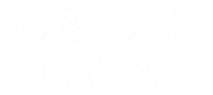 The logo for Walden Lakes features bold, uppercase text with a modern font style, displayed in white, emphasizing the property's branding.