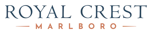 ROYAL CREST MARLBORO logo. Blue-gray text with peach accent text.