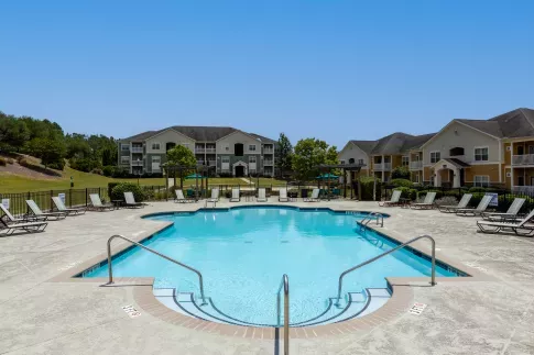 Market Street Station large, sparkling swimming pool with lounge chairs surrounding the pool.