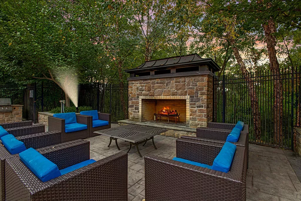 Outdoor fireplace with ample seating to enjoy late nights outside.