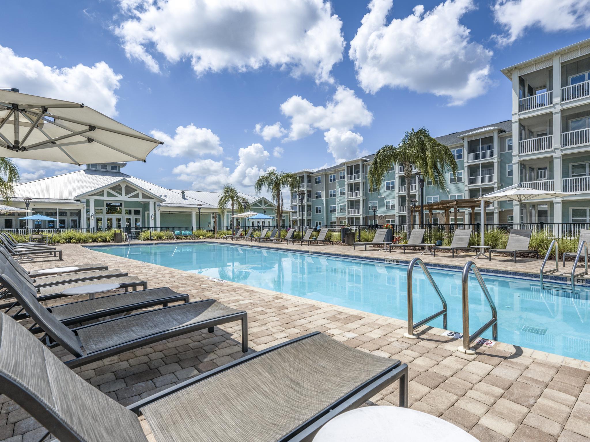 Parc At Wesley Chapel's large, resort style pool with ample seating and conveniently located near parking.